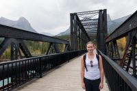 Sara smiling on the Bow River railroad bridge