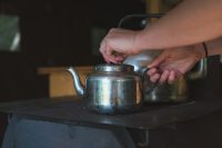 Preparing a morning meal on the wood cookstove.