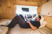 We spread out for our bedtime reading. The platform tents can sleep six people. There’s a room with a king-size bed, a cabinet bed for two, and another room with a bunk bed.