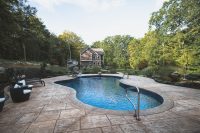 The view of the main house from the pool house vantage point illustrates the expanse of the property and your privacy.