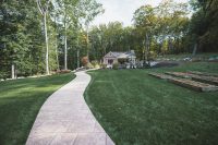 The pool house sits beyond the main house and offers privacy.