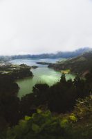 Lagoa das Sete Cidades, the Lagoon of the Seven Cities, is one of the most popular attractions on São Miguel. Although technically one lake separated by a bridge, the two halves reflect light slightly differently, making one appear blue and one green. This view is that from Miradouro da Vista Do Rei.