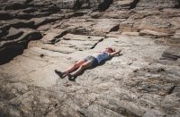 The day use fee at Two Lights State Park also allows you to lounge on rocky outcrops.