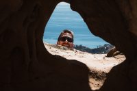 Peeking through Africa on Skull Rock at the top of the Temescal Canyon Trail in Topanga State Park in Los Angeles, California.