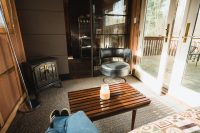 The Ravens Nest living area opens onto the deck overlooking the pond.