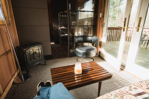 The Ravens Nest living area opens onto the deck overlooking the pond.