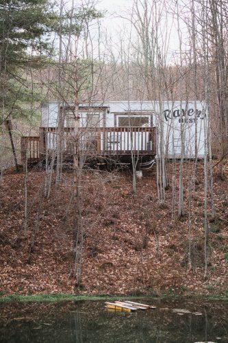 The Ravens Nest is a re-purposed box truck that overlooks the pond.