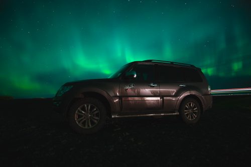 Our Kuku Camper basking under the Northern Lights.